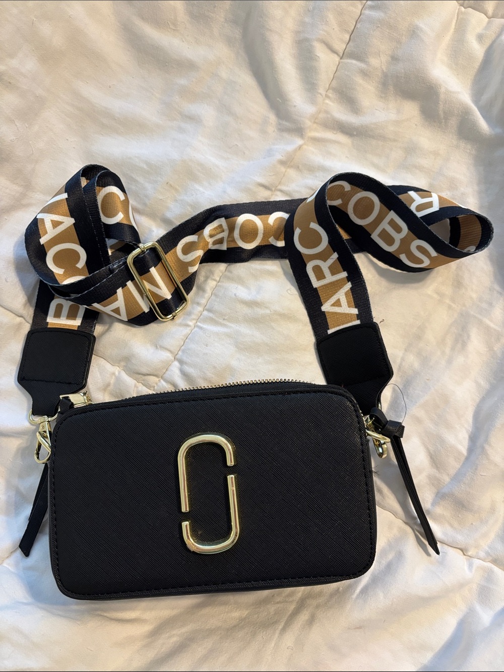Marc Jacobs dupe black crossbody with gold hardware and logo strap